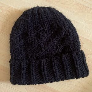 knit black beanie by Eugenia Kim